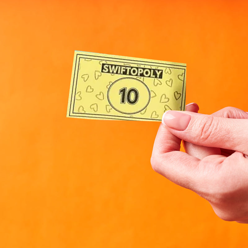 Muziekgebaseerd bordspel met songkaarten en Monopoly-geld voor spelavonden