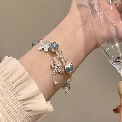 Hemelsblauwe Vlinderarmband met Bloemenmotief - Lila